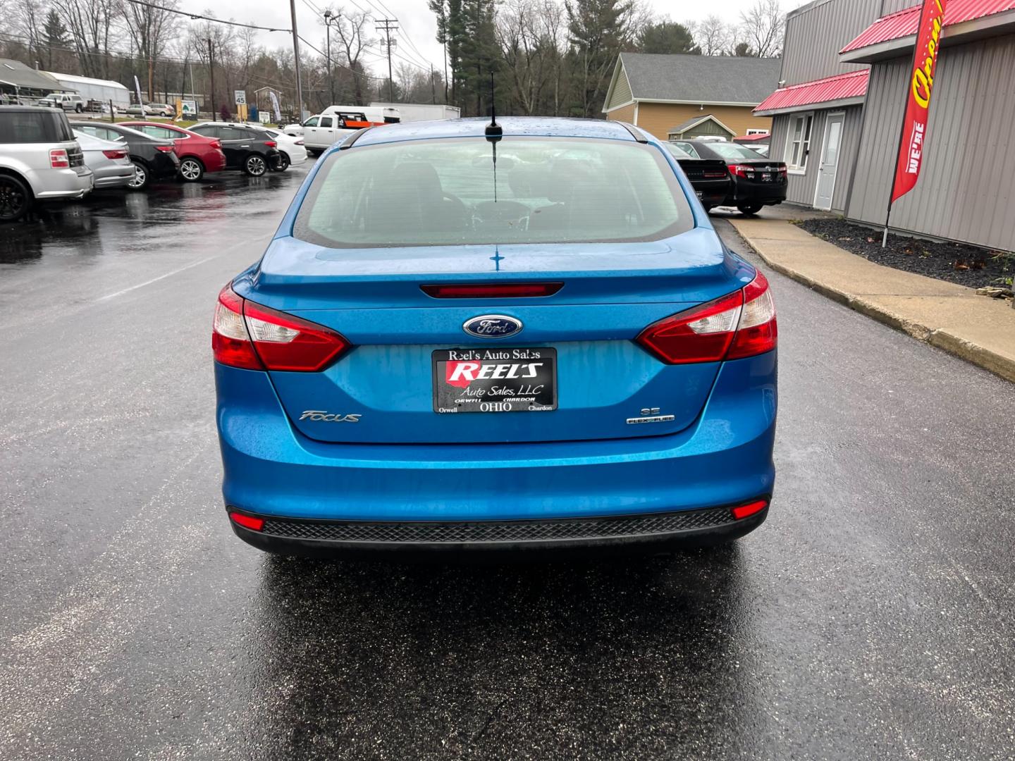 2014 Blue /Black Ford Focus SE Sedan (1FADP3F2XEL) with an 2.0L I4 DOHC 16V FFV engine, 6-Speed Automatic transmission, located at 547 E. Main St., Orwell, OH, 44076, (440) 437-5893, 41.535435, -80.847855 - Photo#8